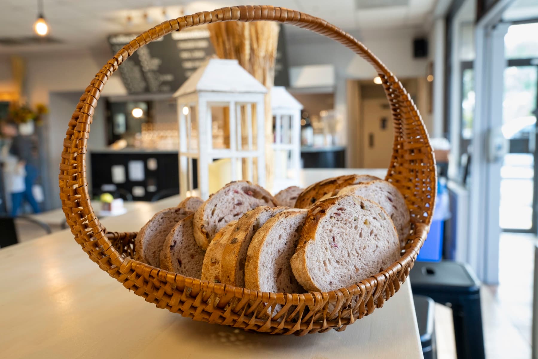 Sliced German rye bread in a woven basket on the counter at Mama G's, Sarasota